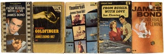Ian Fleming's James Bond and related novels. Group lot comprising: Moonraker, From Russia With Love (2 copies), Dr. No (2 copies), Goldfinger, Thunderball (2 copies), The Spy Who loved Me, On Her Majesty's Secret Service, James Bond The Spy Who Loved Me, The Diamond Smugglers and 007 A Report.